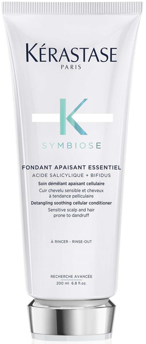 Een witte fles Kérastase Symbiose kalmerende conditioner voor gevoelige hoofdhuid en haar. Het is 200 ml.