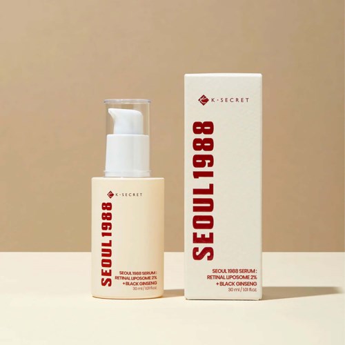 A skincare product with a white pump bottle and a tall rectangular box, both labeled "SEOUL 1988" and "K-SECRET."
