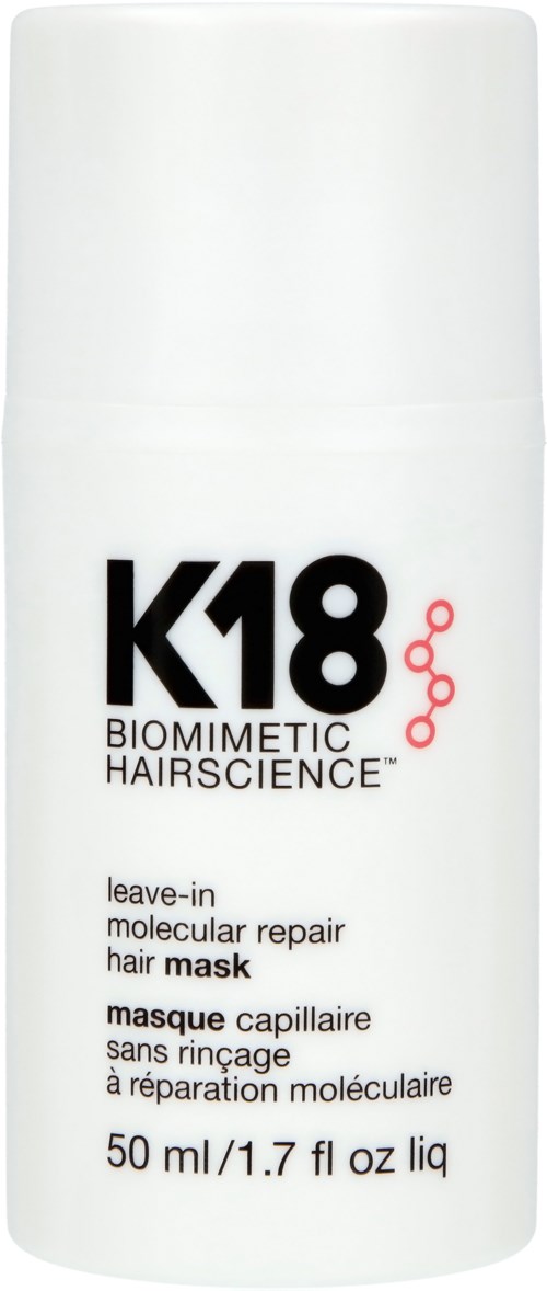 A white bottle labeled K18 biomimetic hair repair mask for damaged hair. It contains 50 ml of leave-in treatment.