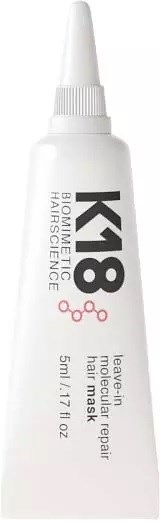 En vit tub med K18 Bio-Repair Hårmaskin med spetsad kork, märkt för hårreparation och behandling, 5 ml storlek.