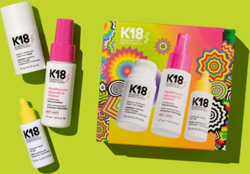 Four bottles of hair care products with colorful packaging and a box featuring vibrant patterns. Labels show product details.