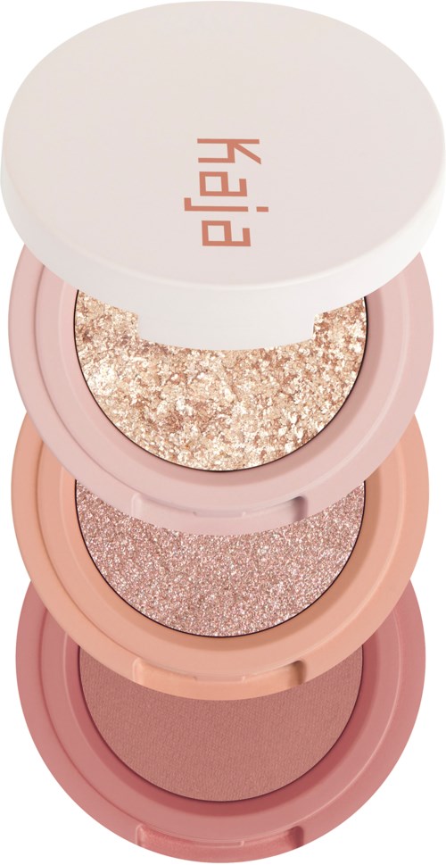 Four round makeup containers stacked, each with different shimmery and matte shades of pink and gold. Label 'Elle' on top.