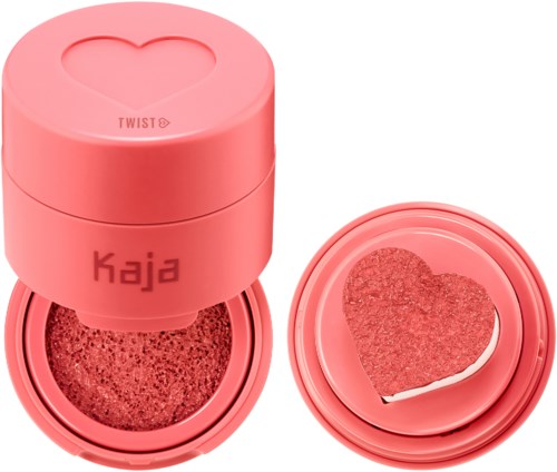 PINKKI pyöreä rasia, jossa sydämen muotoinen jälki, sisältää meikkisienen tai poskipunan sydämen muotoisena, ja irrotettava kansi.