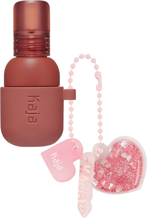Ein rosa, runder Gegenstand mit einem Behälter und einer Perlenkette, verbunden mit einem herzförmigen Zubehör.