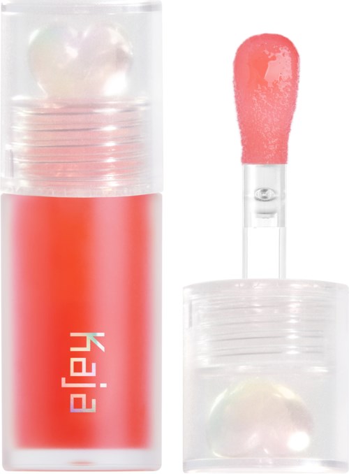 Lippenbalsem tube met sponsapplicator en een parel erin.