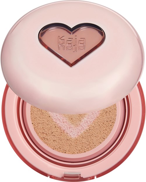 A pink round compact with a heart-shaped window showing the brand logo inside. It contains face powder.