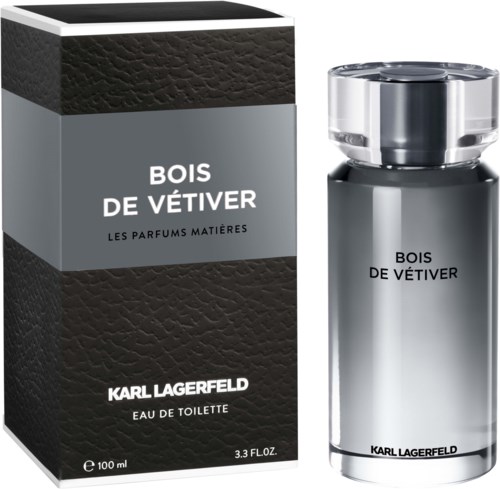 Ein Parfümflasche mit schwarzem und silbernem Design, namens Bois de Vêtiver von Karl Lagerfeld, neben seiner Verpackung.