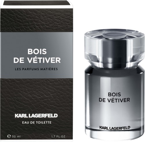 Ein Parfümflasche und eine Box mit der Aufschrift 'Bois de Vétiver' von Karl Lagerfeld, hauptsächlich schwarz, silbern und grau.