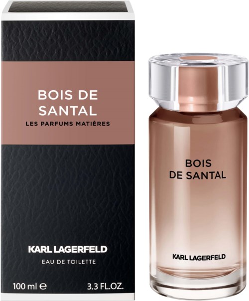 Ein Parfümflasche und eine Box mit der Aufschrift 'Bois de Santal' von Karl Lagerfeld, schlichtes edles Design in zartrosa.
