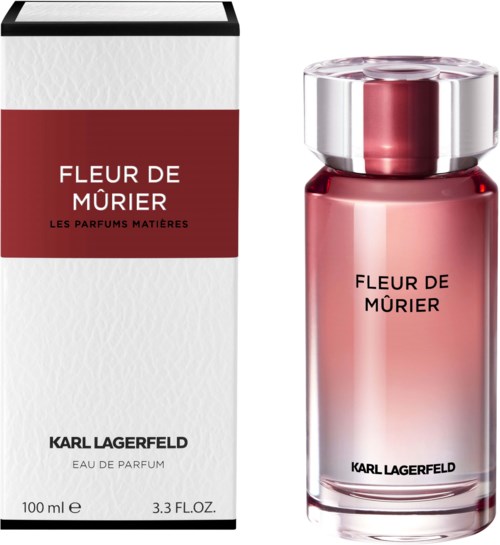 Ein Parfümflasche und eine Schachtel mit der Aufschrift 'Fleur de Mûrier' von Karl Lagerfeld, in Rot und Weiß.