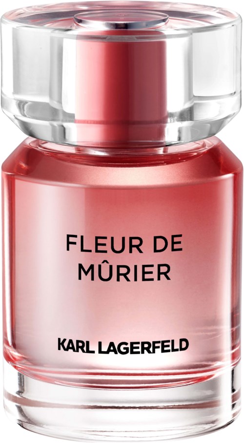 Eine rosa Parfümflasche mit klarem runden Deckel und schwarzem Text, gekennzeichnet 'FLEUR DE MÜRIER' und 'KARL LAGERFELD'.