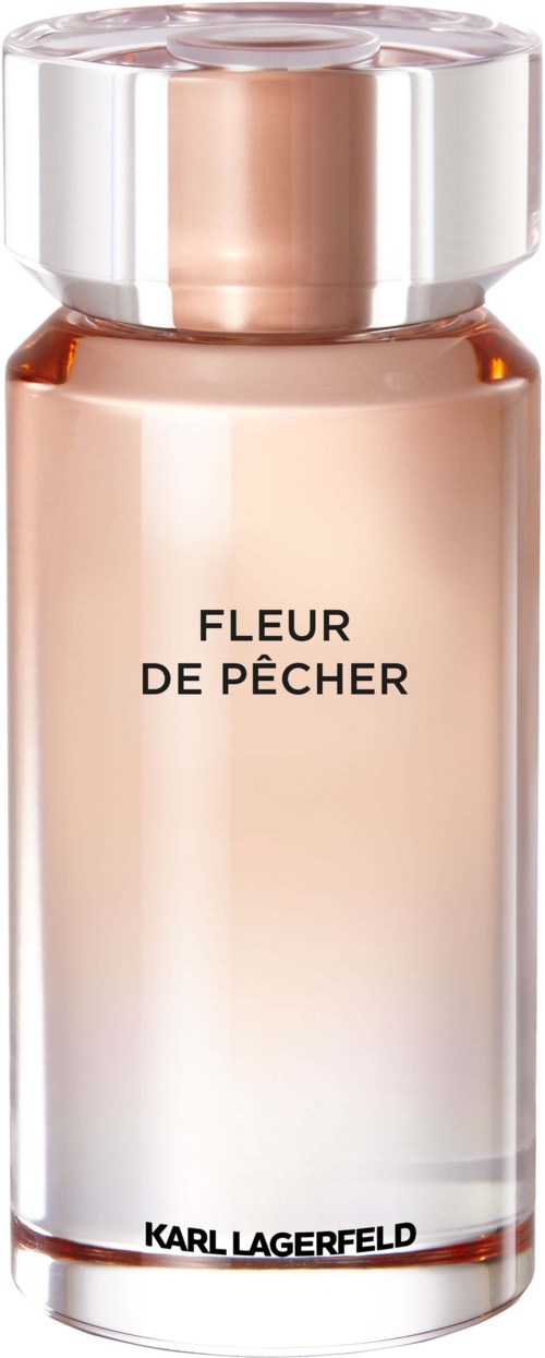 Ein Parfümflakon mit klarem Glas, silberner Deckel und pfirsichfarbiger Flüssigkeit, bezeichnet 'FLEUR DE PÊCHER'.