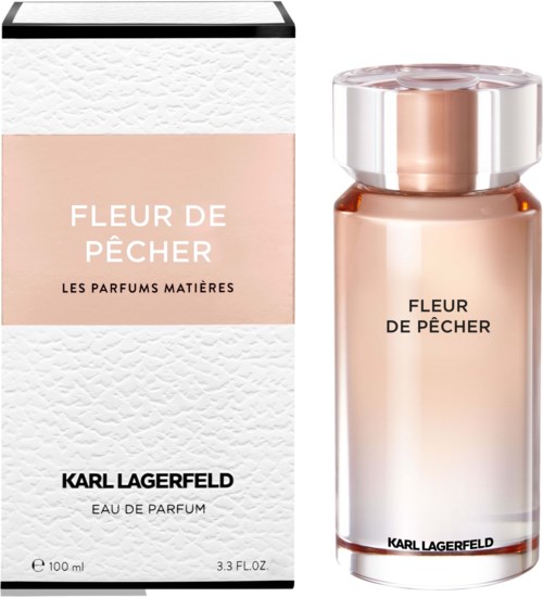 Parfümflasche und Verpackung mit 'Fleur de Pêcher' von Karl Lagerfeld, hell rosa und weißes Design.