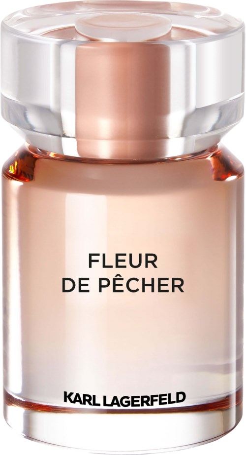 Ein Parfümflasche mit der Aufschrift 'Fleur de Pécher' von Karl Lagerfeld, durchsichtiges Glas und goldene Parfüm innen.