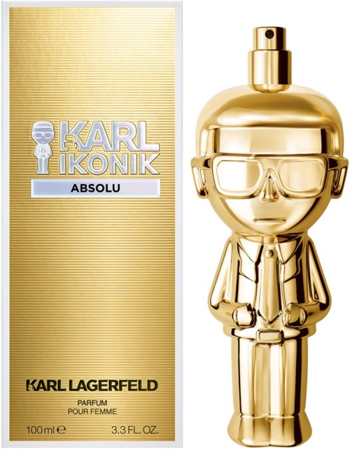 Goldfarbige Parfümflasche in Form einer Person mit Brille und Anzug. Box daneben hat Gold- und Silbendesign.