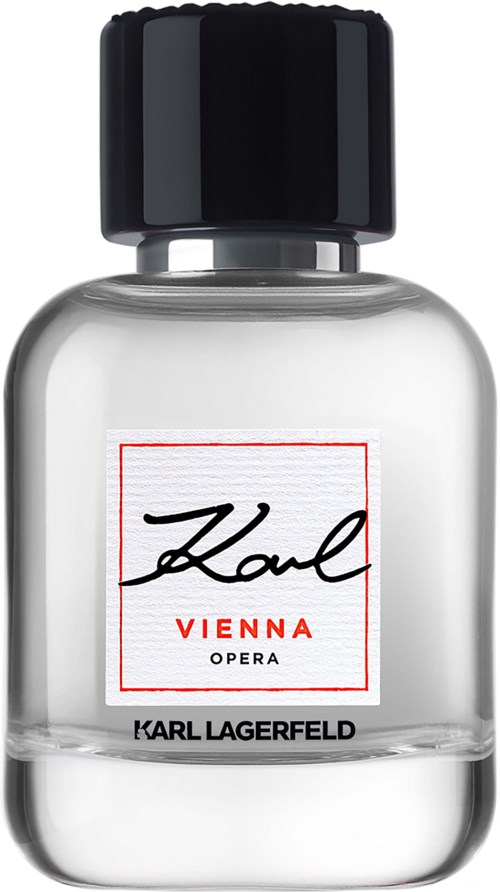 Läpinäkyvä hajuvesipullo mustalla kannella, valkoinen etiketti ja punainen teksti 'Karl Lagerfeld Vienna Opera'.