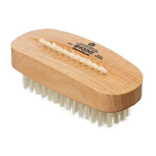 A wooden scrub brush with white bristles and a handle for cleaning surfaces.