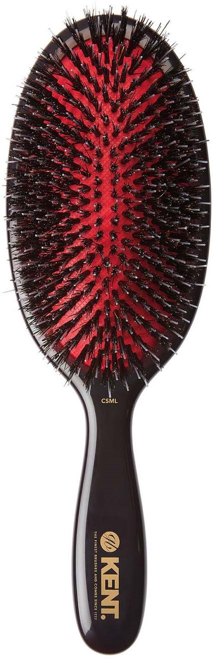 A hairbrush with black and red bristles, oval shape, and the brand name 'KENT' on the handle.