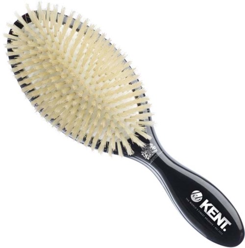 A black-handled hairbrush with cream-colored bristles evenly spaced and slightly curved.