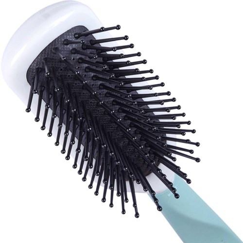 A hairbrush with a white handle and black bristles, used for brushing hair.