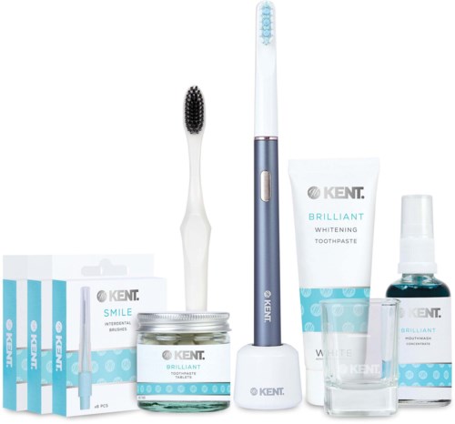A set of oral care products including an electric toothbrush, manual toothbrush, toothpaste, mouth spray, and floss.