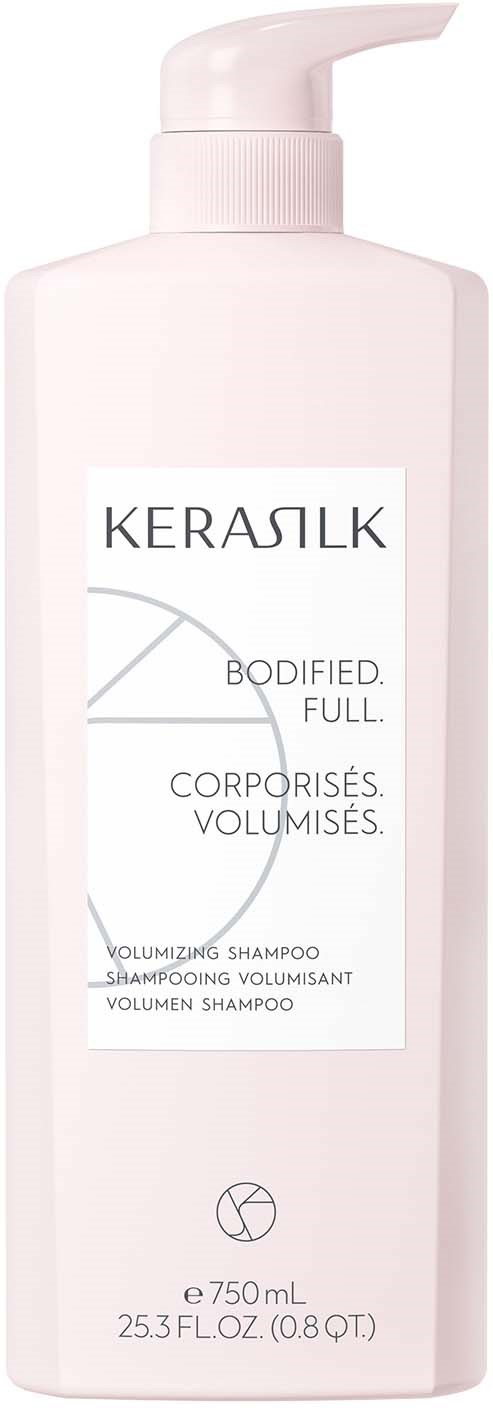 Een lange roze fles met pomp, labeled KERASILK, belooft volume en vollheid voor haar, 750 mL.