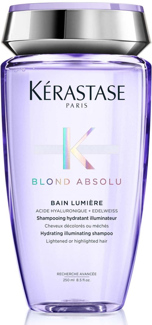 A purple bottle of hair shampoo with a shiny silver cap, labeled Blod Absolu by Kerastase, for brightened hair.