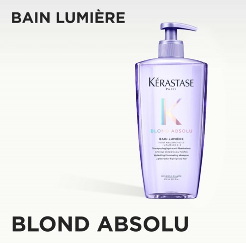 A purple shampoo bottle from Kérastase with a pump, labeled Blond Absolu, against a white background.