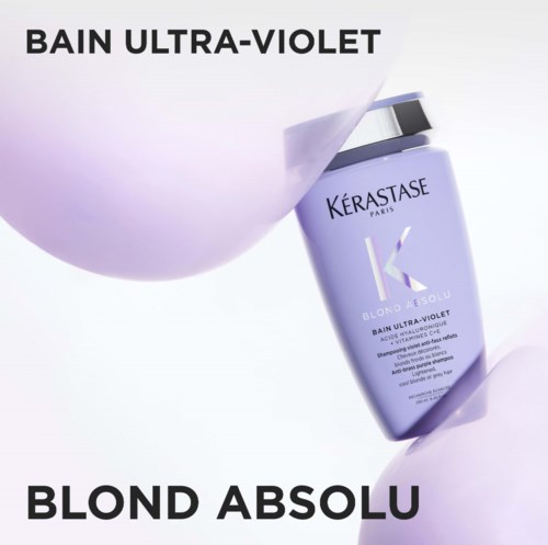 Eine lila-Shampoo-Flasche mit Klappdeckel, umgeben von weichen lila Kugeln, mit Text über violette Haarpflege.