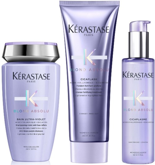 Drei Kérastase-Haarpflegeprodukte in lila und silberner Verpackung, inklusive Shampoo, Conditioner und Serum.