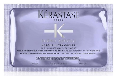 En paket med blekmedel för hår, med varumärket Kérastase och produktinformation för blond behandling.