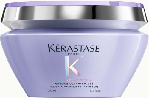 A purple jar of hair mask with silver and violet lid, labeled Kerastase Paris, for blond hair care.