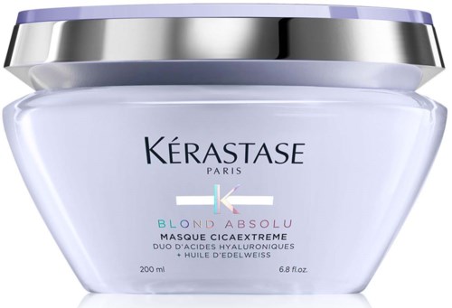 Een wit haarmasker met paarse en zilveren deksel, gelabeld "Kérastase Blond Absolu Masque Cicaextreme."