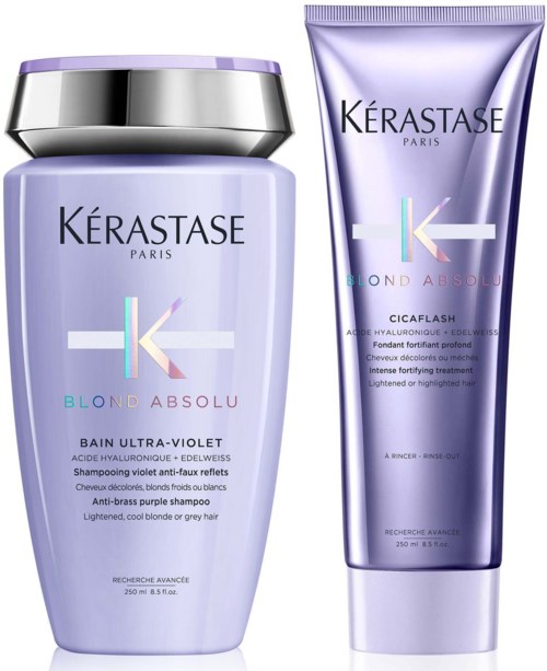 Zwei lilafarbene Haarpflegeprodukte von Kerastase, eine Shampoo-Flasche und eine Tube Conditioner oder Behandlung.