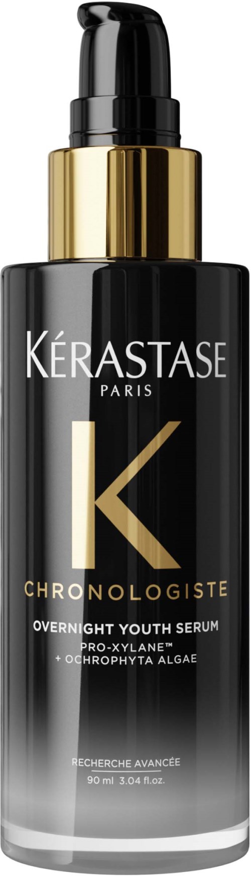 Een zwarte en gouden fles Kerastase Chronologiste Youth Serum met pompje.