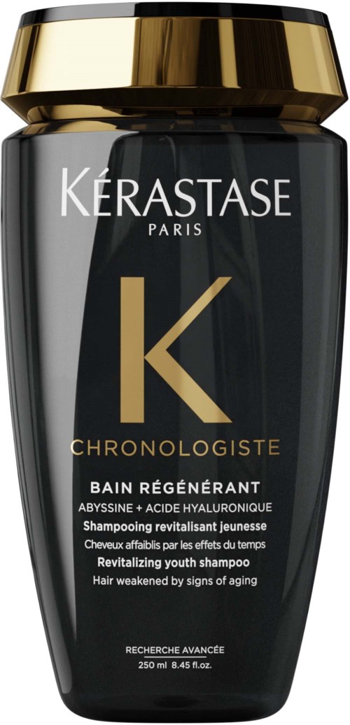 Een zwart en goud flesje met revitaliserende jeugdshampoo voor haar met tekenen van veroudering.