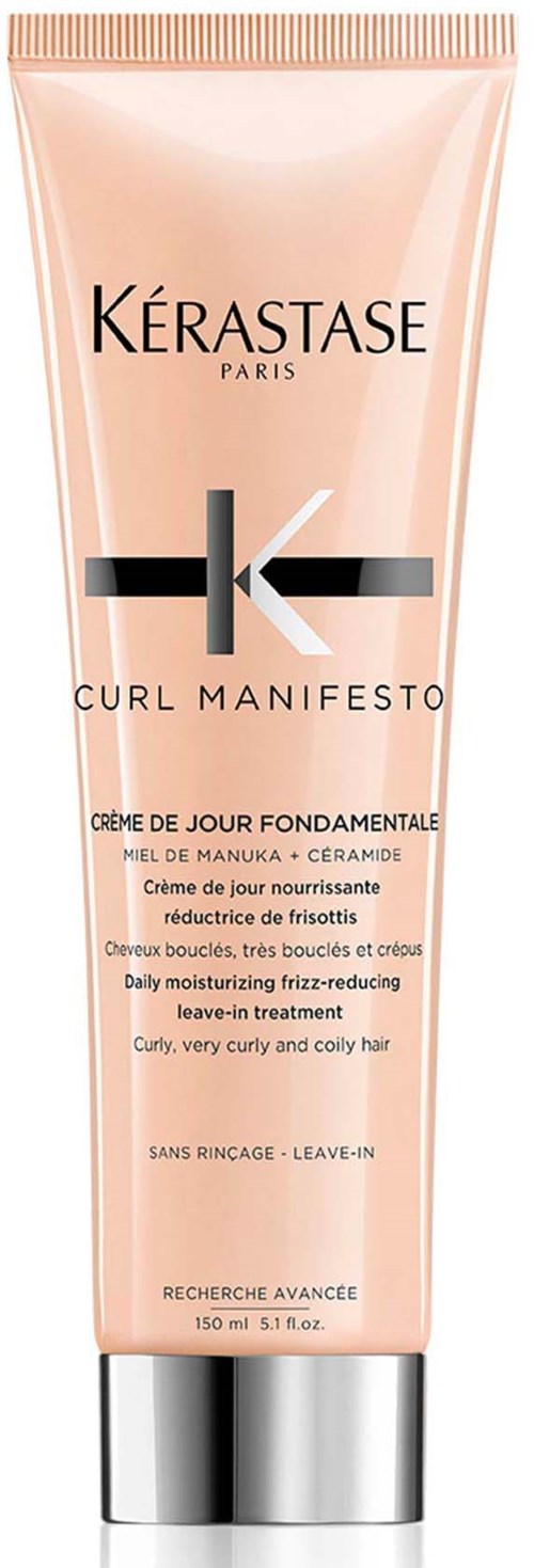 A pink tube of Kerastase Curl Manifesto leave-in treatment for curly, curly, and coily hair. Contains honey and ceramide.