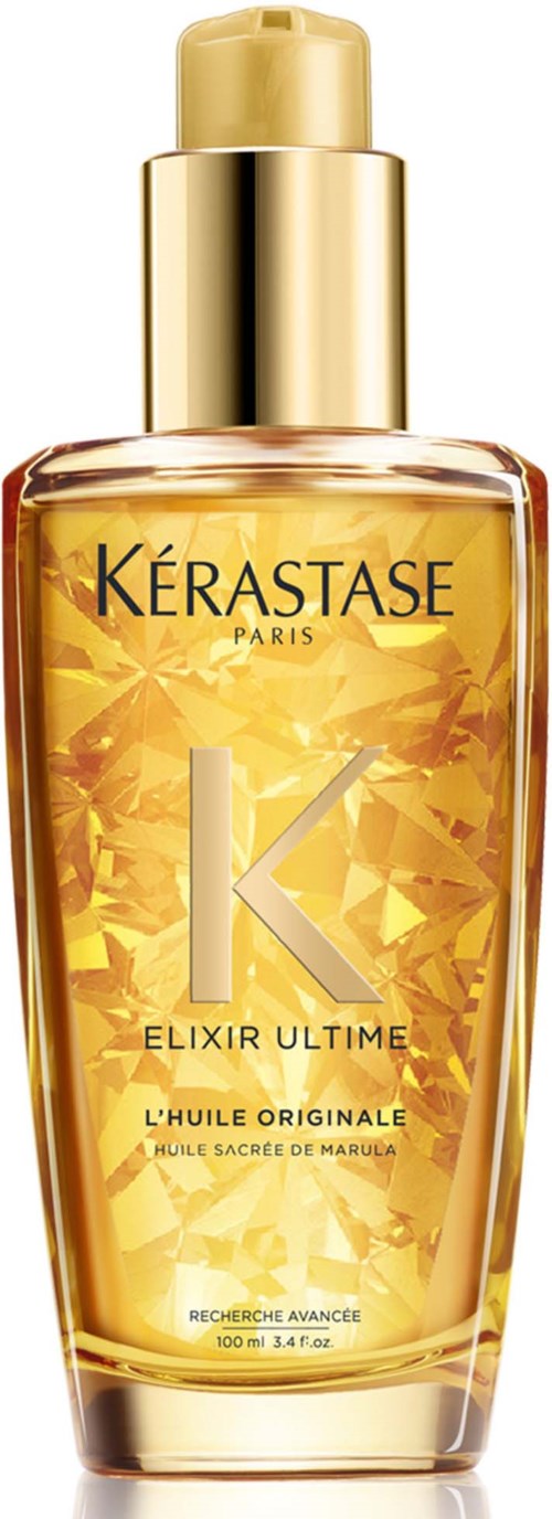 Eine goldene Flasche Kérastase Elixir Ultime Haaröl mit goldener Kappe und glänzendem gelbem Etikett.