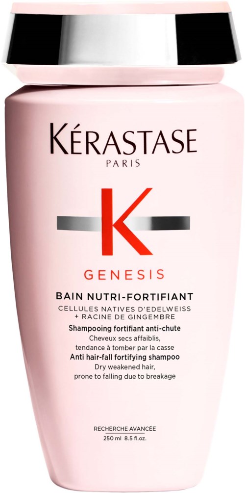 Een roze flesje Kérastase Genesis shampoo voor zwak haar, met een zilveren en zwarte dop en productdetails in het Engels.