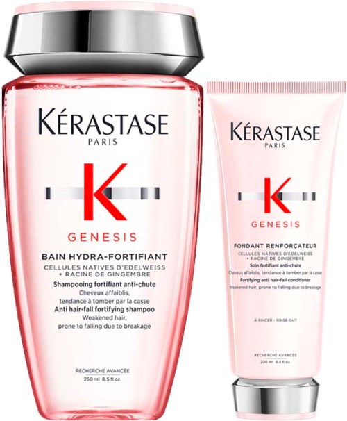 Een shampoo fles en een conditioner tube van de Kérastase Genesis lijn. De flessen zijn roze met zilveren doppen en een grote rode 'K' logo.