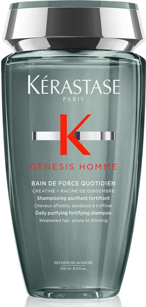 A tall, grey-green bottle with silver cap, labeled 'Kérastase Paris Genesis Homme' shampoo for thinning hair.