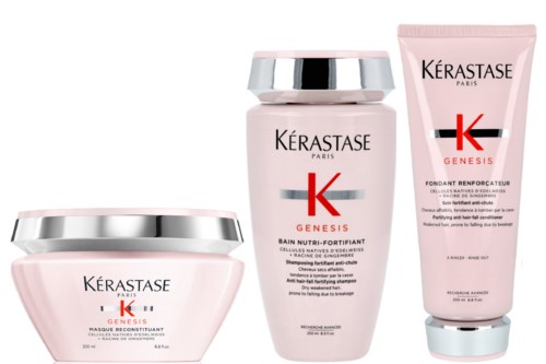 Tre hårvårdsprodukter från Kérastase Genesis-serien i rosa och silver förpackningar.