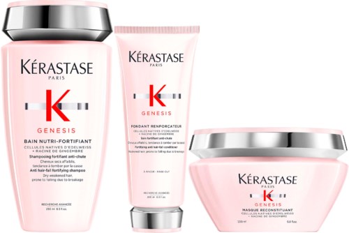 Drie roze Kérastase Genesis haarverzorgingsproducten met zilverkappen, inclusief shampoo, conditioner en masker.