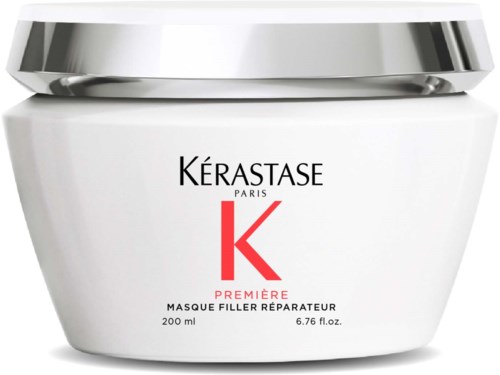 A white jar with a silver lid, labeled for Kérastase Paris hair product, containing 200 ml of repair mask.