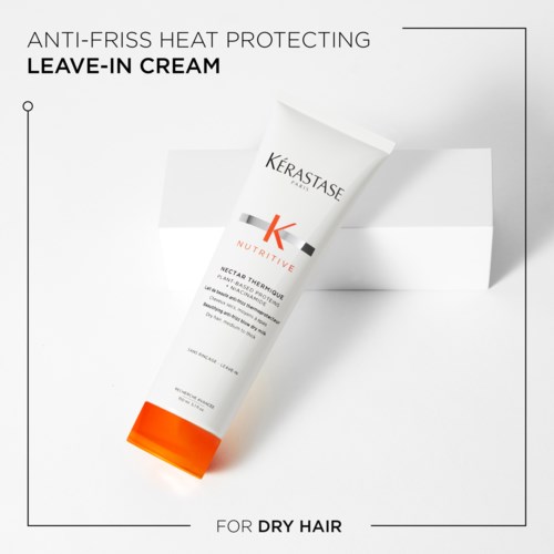 A white tube of leave-in cream for dry hair with orange at the bottom, labeled Kérastase Nutritive Nectar Thermique.