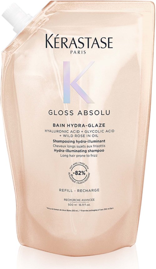 Eine große, beige Flasche mit Kérastase-Haarshampoo mit Textbeschreibung.