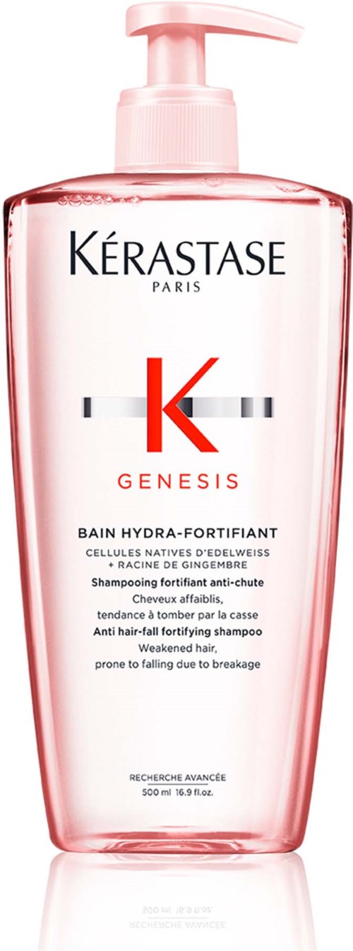 Een roze fles Kérastase Genesis shampoo met pomp, bedoeld voor haarversterking en haaruitval.
