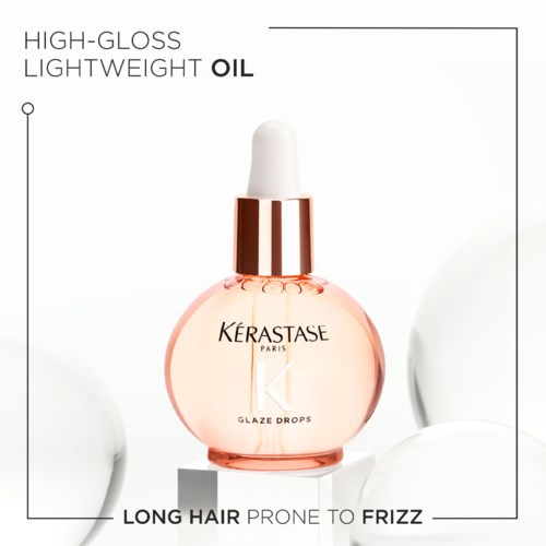 A bottle of Kérastase Glaze Drops hair oil for long hair, lightweight and high-gloss, suitable for frizz control.