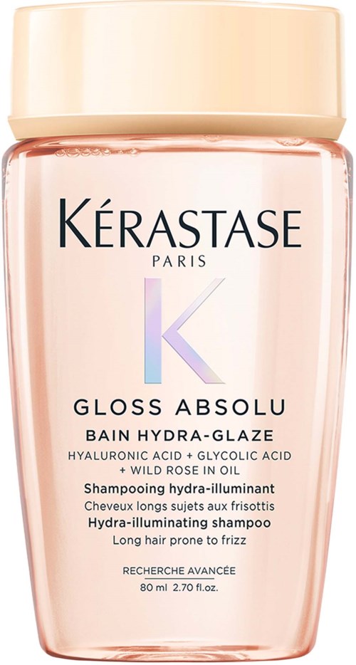 It is a pink bottle of Kérastase Gloss Absolu Hydra-Glaze shampoo for long, frizzy hair with hyaluronic and glycolic acids.