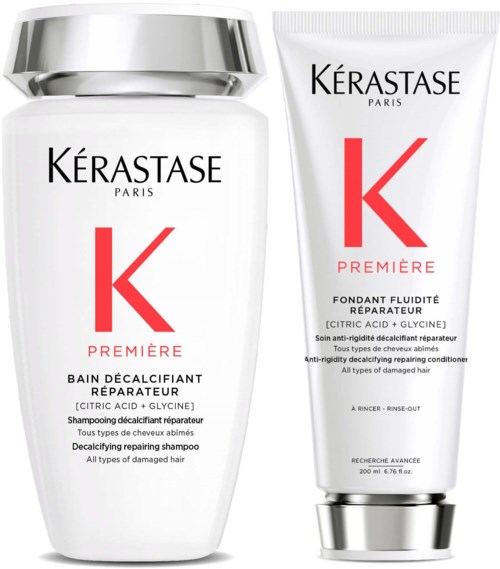 Two hair care products from Kérastase, one bottle and one tube, with white and silver packaging.